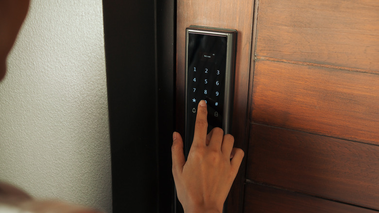 Smart lock keypad on wooden door