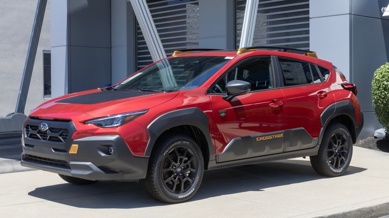 red Subaru Crosstrek parked in driveway