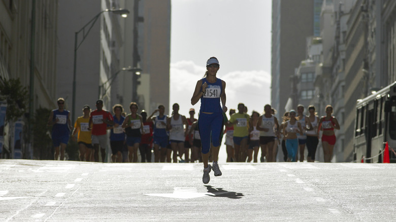 runner ahead of the pack in a marathon