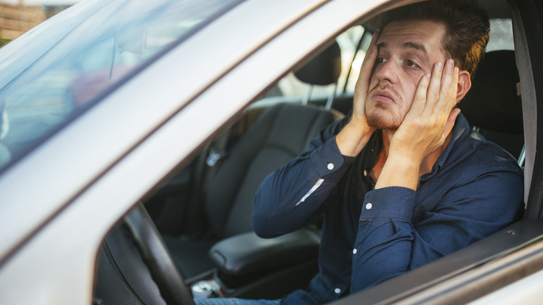 Frustrated Driver With His Hands On His Face