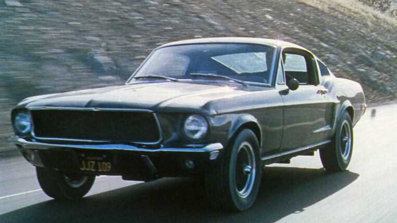 Bullitt driving his Mustang down the road