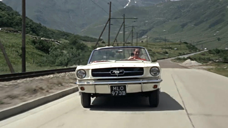 Classic Ford Mustang on the road in Goldfinger