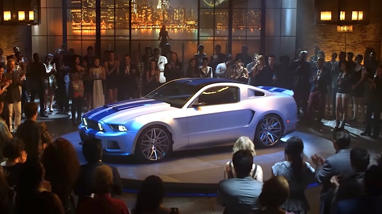 Shelby Mustang on display on stage at a party in Need For Speed