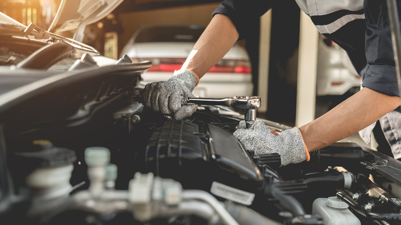 mechanic fixing car