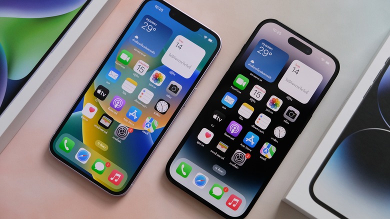 two iPhones lying on a table