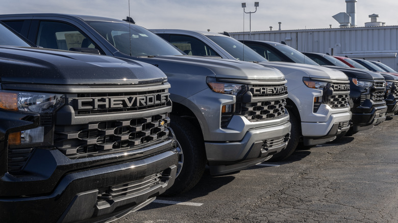 silverados in parking lot