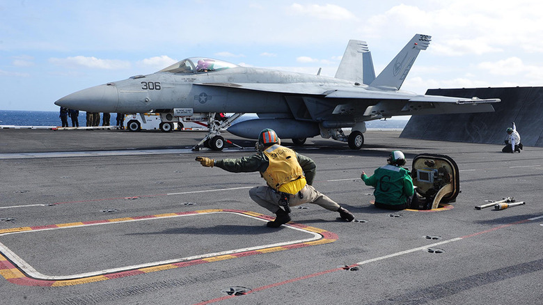 The Boeing F/A-18 Super Hornet taking off from an aircraft carrier