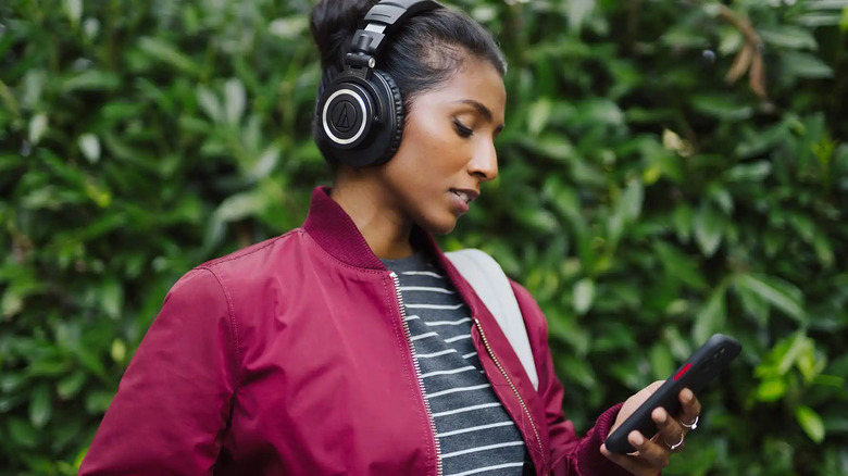 woman wearing Audio-Technica ATH-M50xBT2