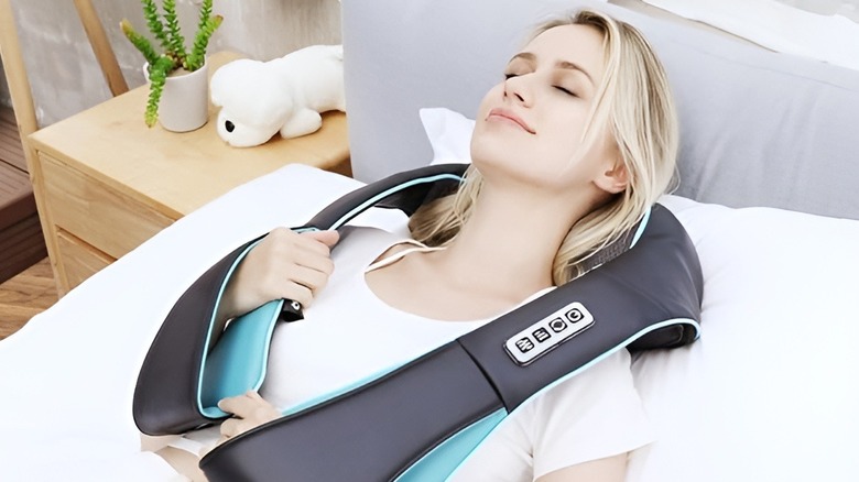 Woman using neck massager