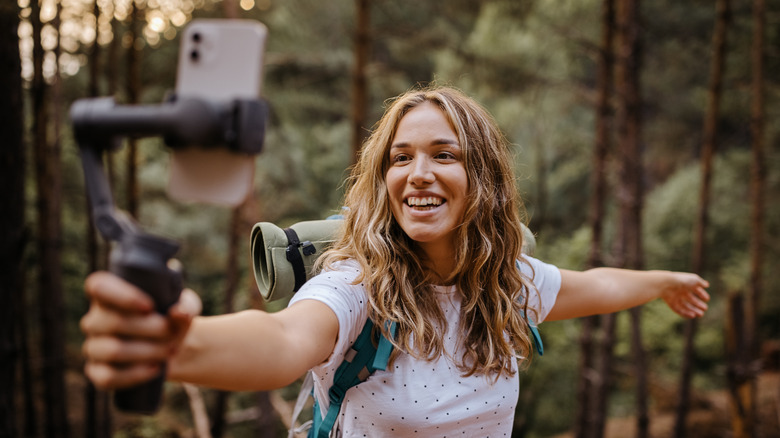 Woman filming herself with phone