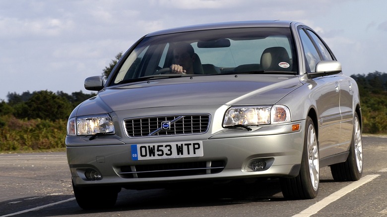 silver Volvo S80 driving on road