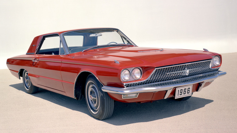 A red 1966 Ford Thunderbird hardtop.