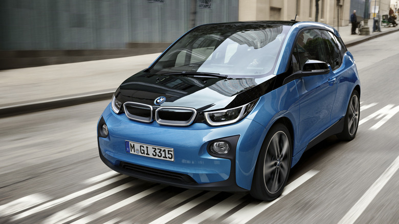 Blue and black BMW i3 on the road