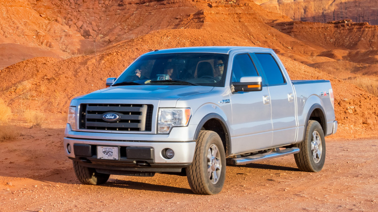 White Ford F-150 in desert landscape