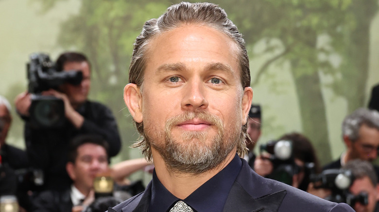 Charlie Hunnam smirking