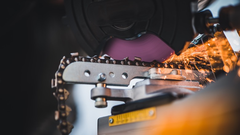 chainsaw chain being sharpened