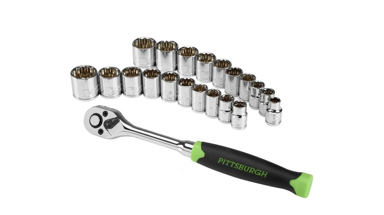 socket wrench next to sockets