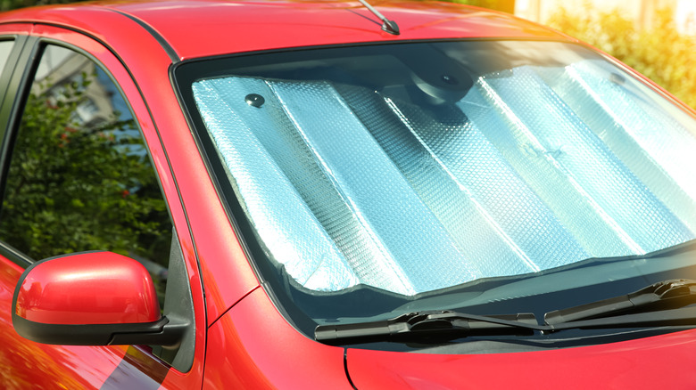 Car with windshield sunshade