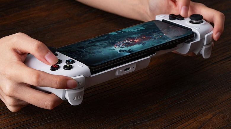 8BitDo Ultimate Mobile Gaming Controller being used with phone installed.