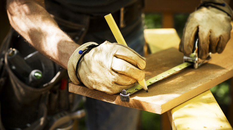 Carpenter marking lumber