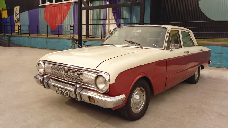 Red and white Ford Falcon sedan