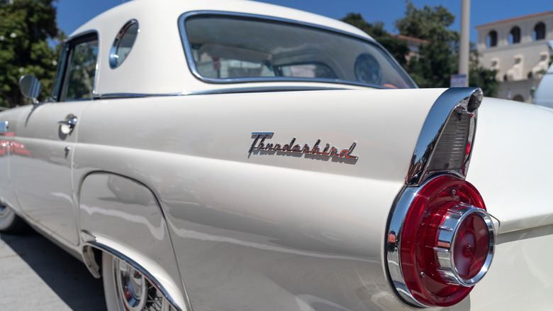 1957 white Ford Thunderbird tailfin and logo