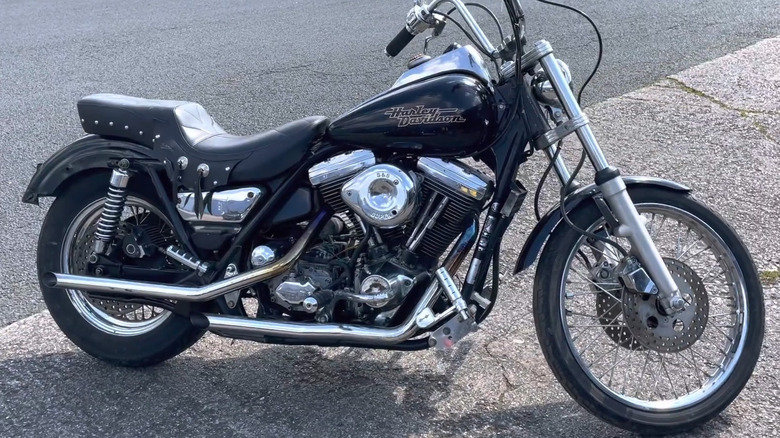 1986 Harley-Davidson FXR Super Glide parked on sidewalk