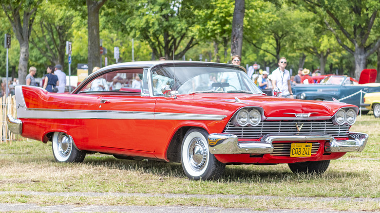 1958 red Plymouth Fury parked