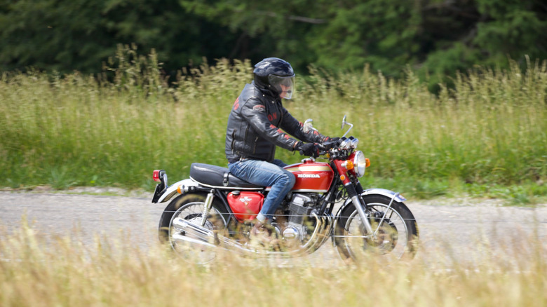 Person riding Honda CB750