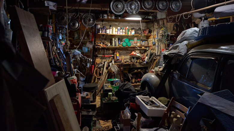 Car in untidy garage