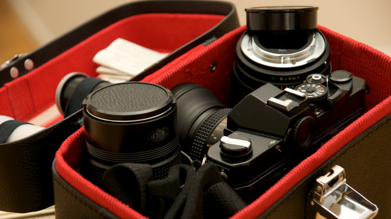 Camera in a red and black camera bag