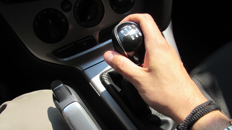 hand on gear shifter