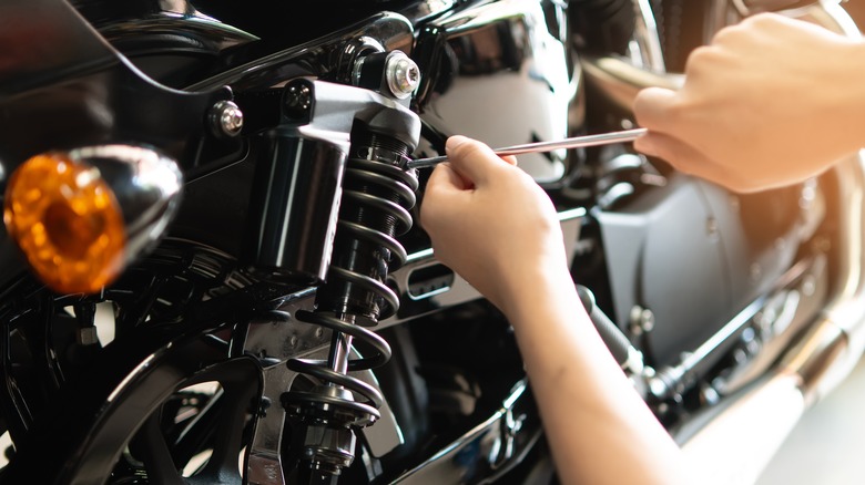 Mechanic fixing motorcycle