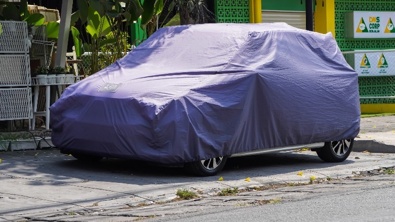 SUV covered while outside