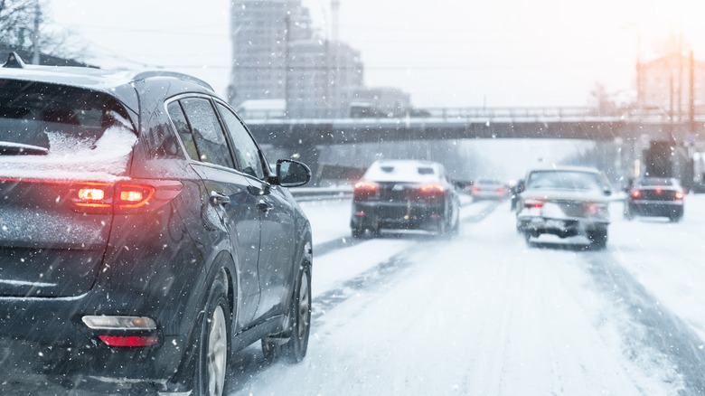 cars driving in the snow