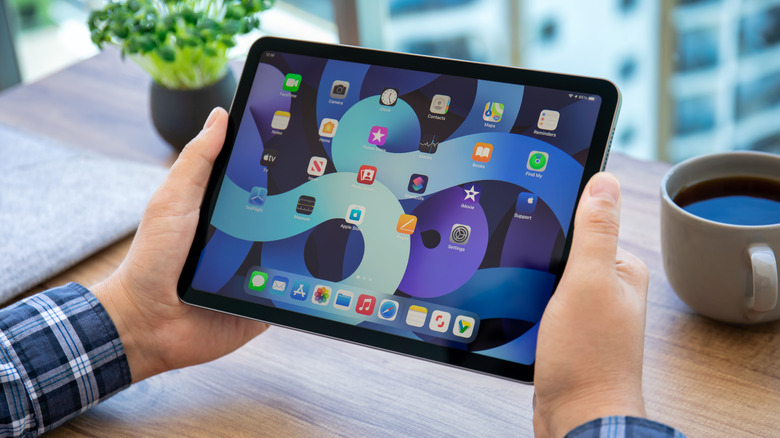 man holding iPad