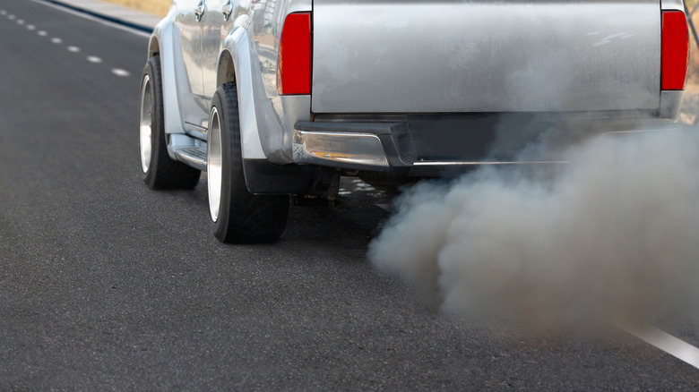 truck emitting black exhaust smoke