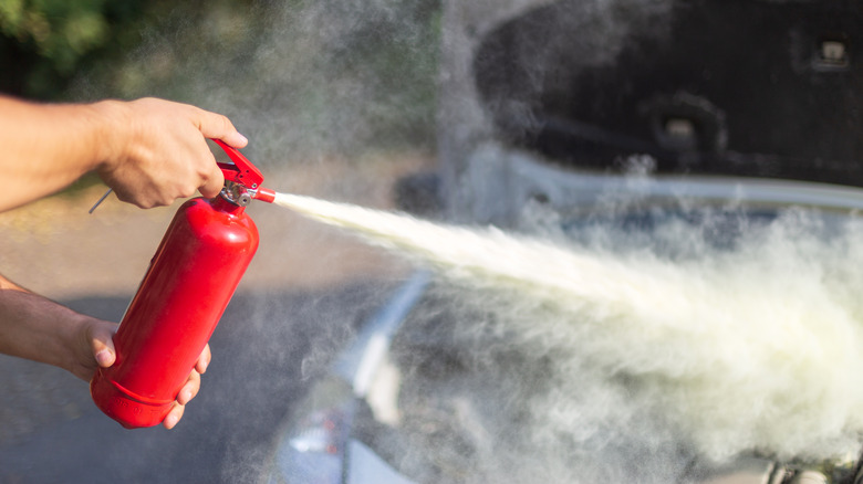 Using fire extinguisher on engine