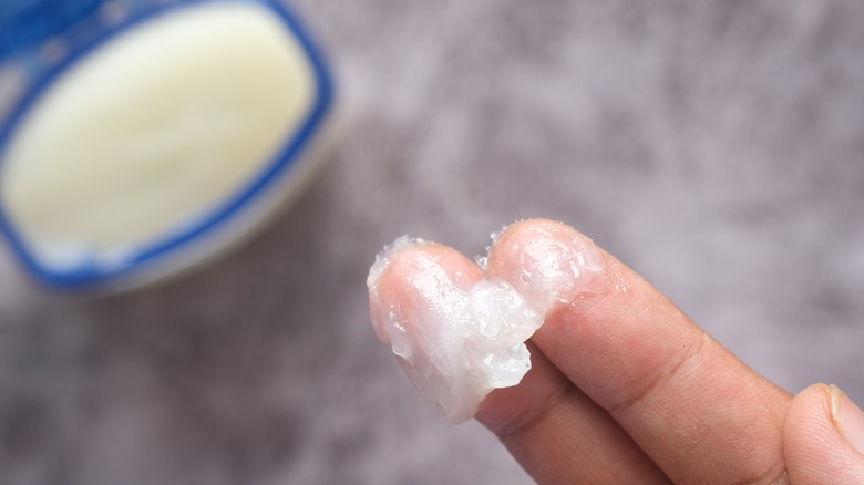 petroleum jelly on fingers