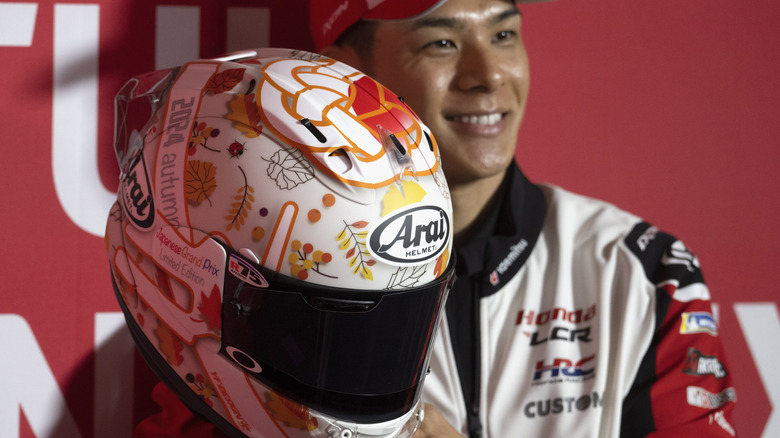 Takaaki Nakagami of Japan holding his Arai helmet