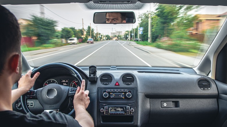 A man driving a car