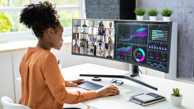 woman working on an ultrawide monitor