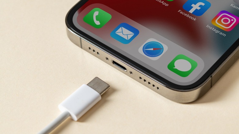 USB cable being connected to a smartphone