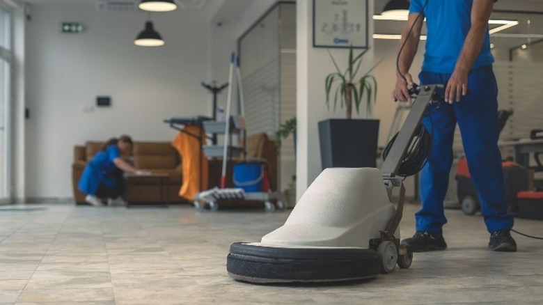 Person using floor grinder