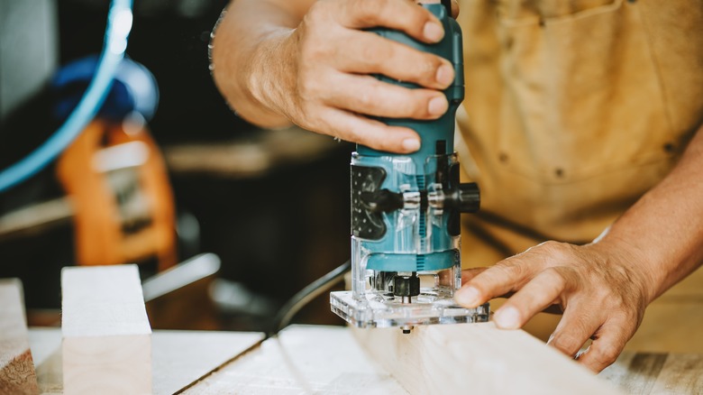 A Man Using A Trim Router