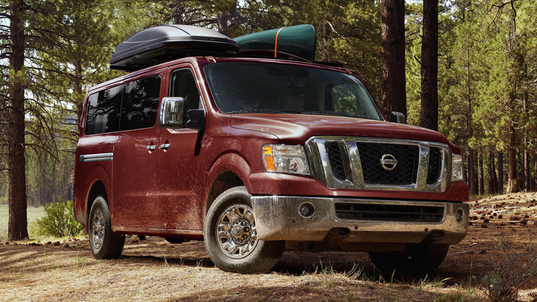 Nissan NV parked in the woods