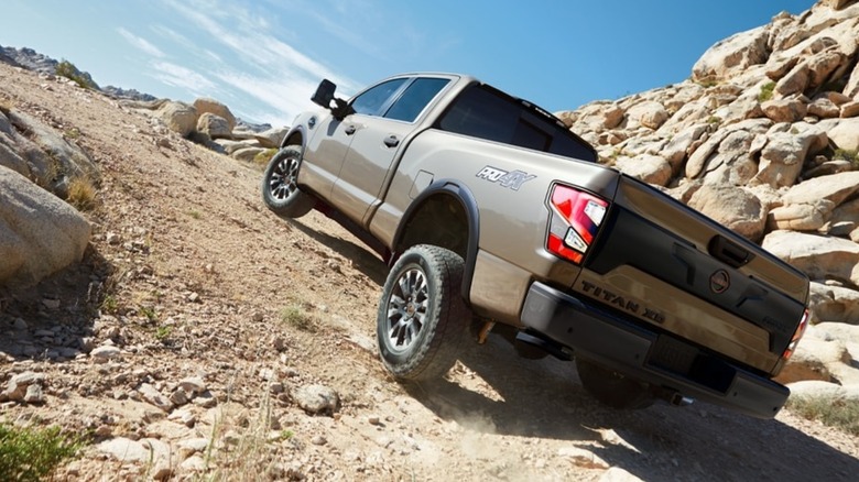 A Nissan Titan XD PRO-4X traversing rocky terrain.