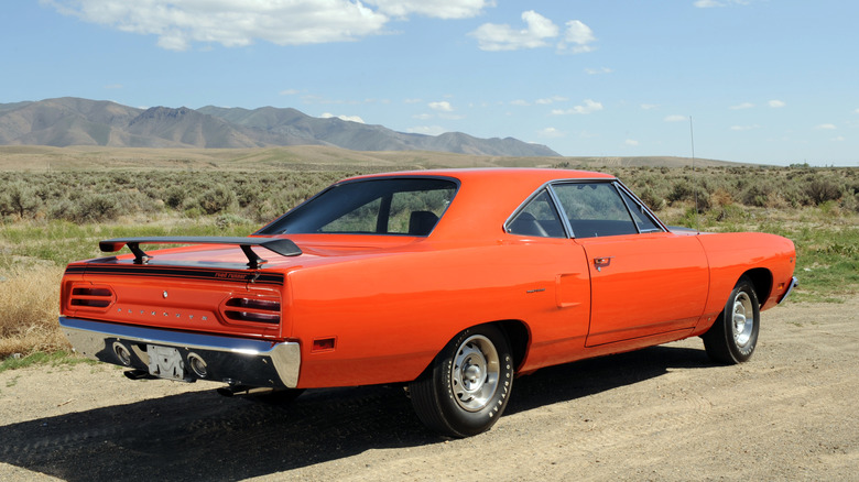 Back of orange Plymouth Roadrunner in desert