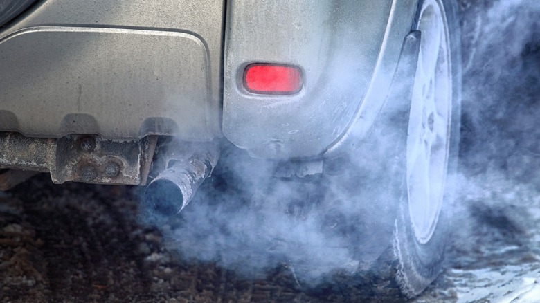 A close up of exhaust pipe smoking