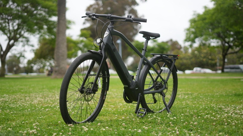 Black electric bike in teh park.